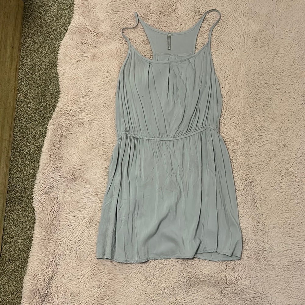 The color is a green type blue color and it is a flurry shirt